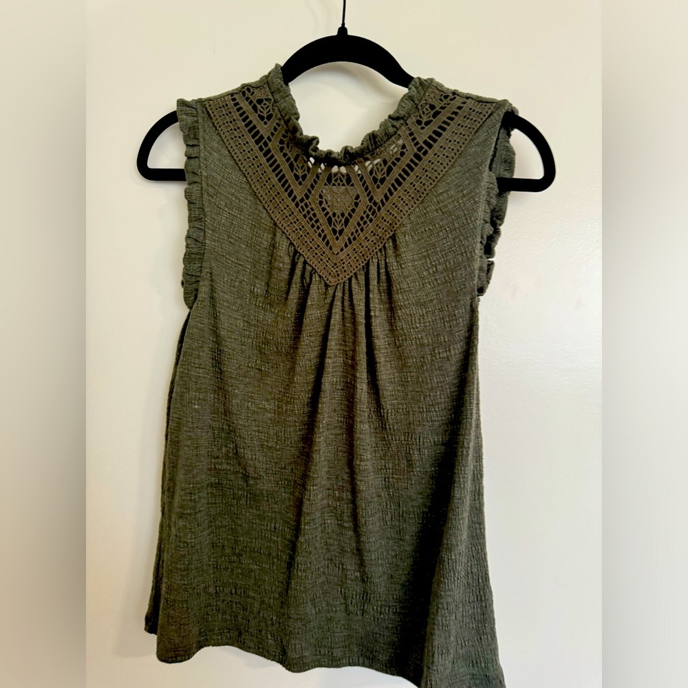 Cute green top with lace detail.